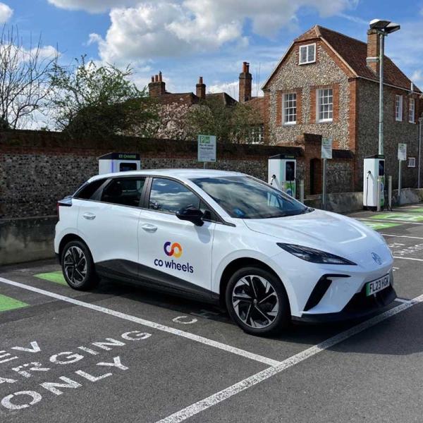 photo of a co wheels electric car parked in a chargepoint space
